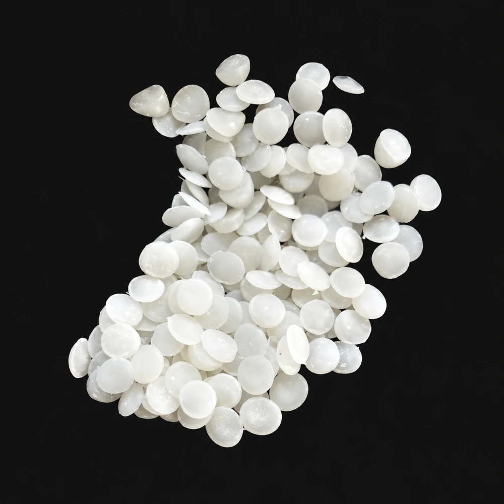 White VCI masterbatch granules on a dark background